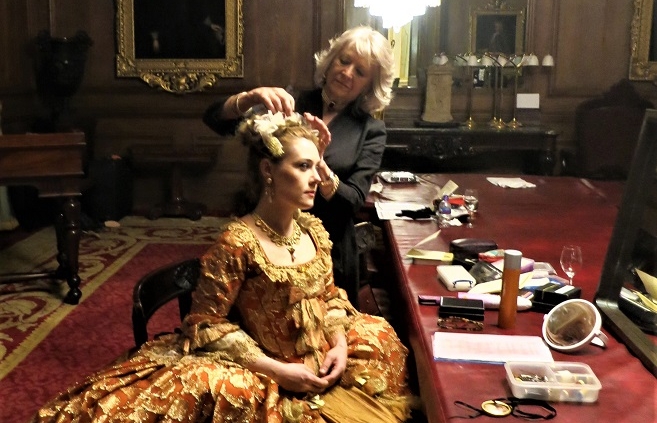 Wardrobe mistress attends to Dorabella's hair in our magnificent dressing room at The Goldsmiths' Hall