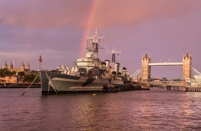 HMS Belfast sits regally on the Thames by Tower Bridge